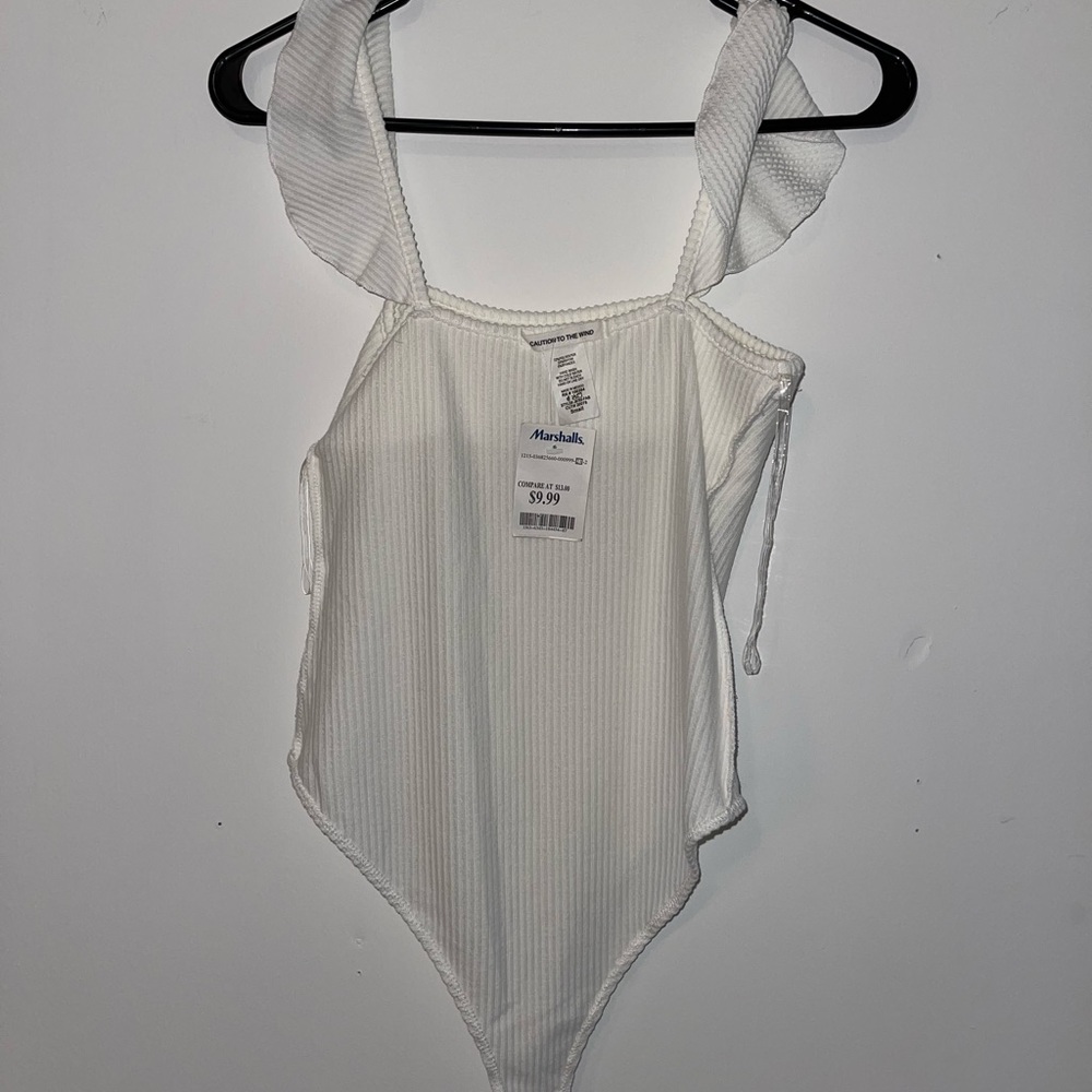 BODYSUIT. White bodysuit with ruffle straps